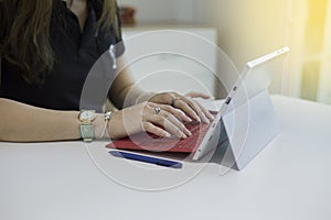 Woman  typing text or words on tablet computer keyboards