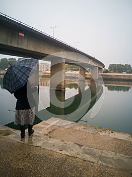 Woman with umbrela  in arles FRANCE