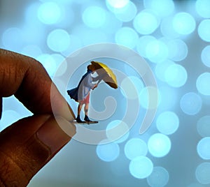 Woman with Umbrella on Bokeh Background