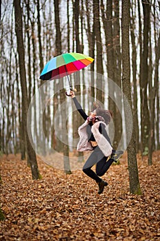 Woman with umbrella dragged by the wind