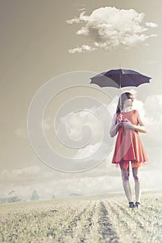 Woman with umbrella is followed by a delicate cloud