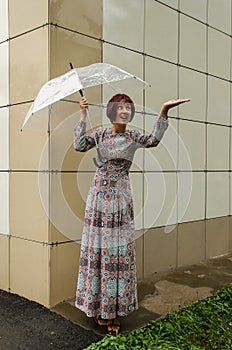 Woman with the umbrella looks a delight