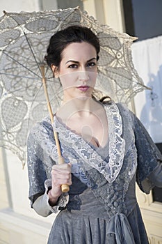 Woman with umbrella on street