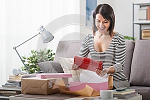 Woman unboxing a parcel photo