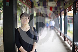 Woman under the promenade of summer palace