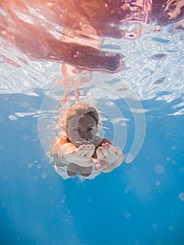 Woman underwater at the pool