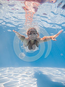 Woman underwater at the pool