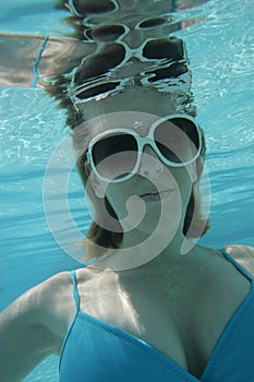 Woman underwater in pool