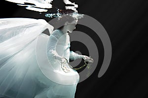 Woman Underwater Wearing White Gown