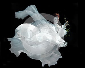 Woman Underwater Wearing White Gown