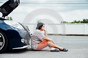 Woman unhappy and dismal from car engine problem