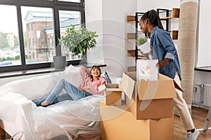 woman unpacking boxes and moving to new home