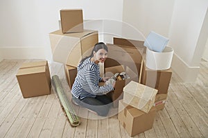 Woman Unpacking Moving Box