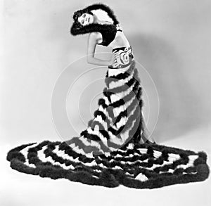 Woman in an unusual dress with stripes of fur