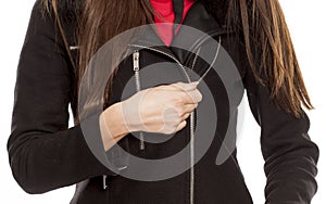 Woman unzipping her coat