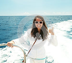 Woman on the upper deck of a cruise ship