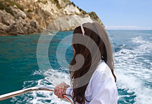 Woman on the upper deck of a cruise ship