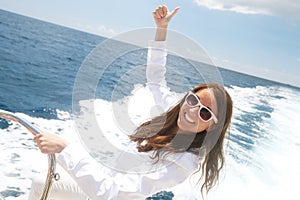 Woman on the upper deck of a cruise ship