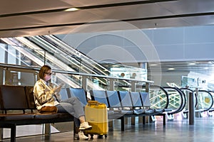 Woman upset over flight cancellation, writes message to family, sitting in almost empty airport terminal due to coronavirus