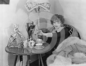 Woman with urn and teacups