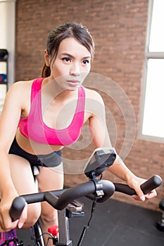 Woman use gym flywheel