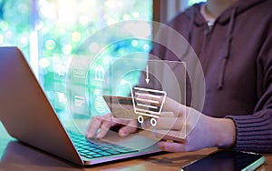 Woman use laptop to shop online with shopping cart and business icons. Purchase order, Digital marketing concept, Retail market on