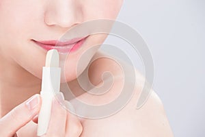 Woman use lip balm