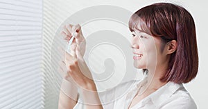 Woman use oil blotting paper