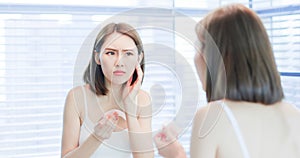 Woman use oil blotting paper