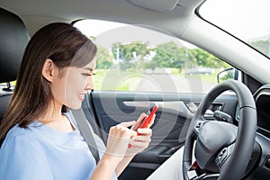 Woman use phone in car