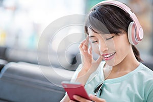 Woman use phone listen music