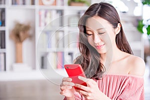 woman use smart phone and feel happy at home