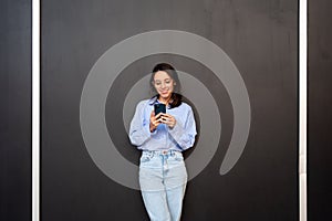 Woman use smartphone isolated on black