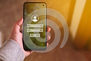 Woman use smartphone to input username and password.