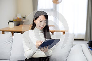 Woman use tablet at home