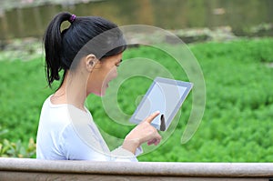 Woman use tablet outdoor