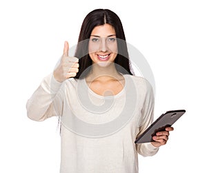 Woman use tablet and thumb up