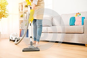 Woman use vacuum cleaner to cleaning photo