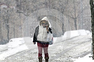 Woman uses cel phone in snow storm