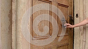 Woman Uses Door Knocker