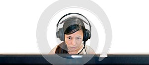 Woman uses a Headset with Microphone on a Personal Computer