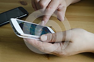 Woman uses his touchscreen smartphone