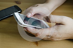 Woman uses his touchscreen smartphone