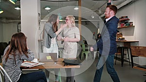 Woman uses laptop finds out good news everyone is happy congratulate and applaud her. business team in startup office