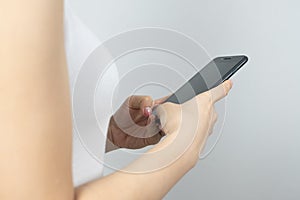 Woman uses she Mobile Phone , close up