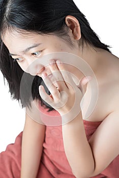 Woman using acne cream isolated on white background. Clipping path on white background.