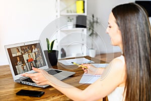 Woman is using app on laptop for video connect