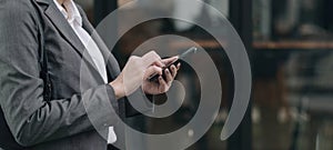 woman using apps on a mobile touchscreen smartphone. Concept for using technology, shopping online, mobile apps, texting,