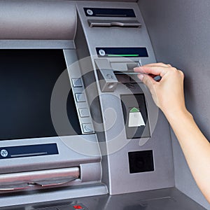 Woman using ATM