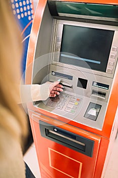 Woman using atm cash machine